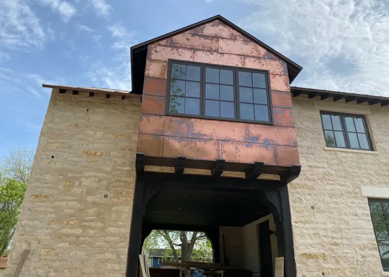 Copper metal panel facade on a stone building for Metal Roof Coating in Chesapeake Beach
