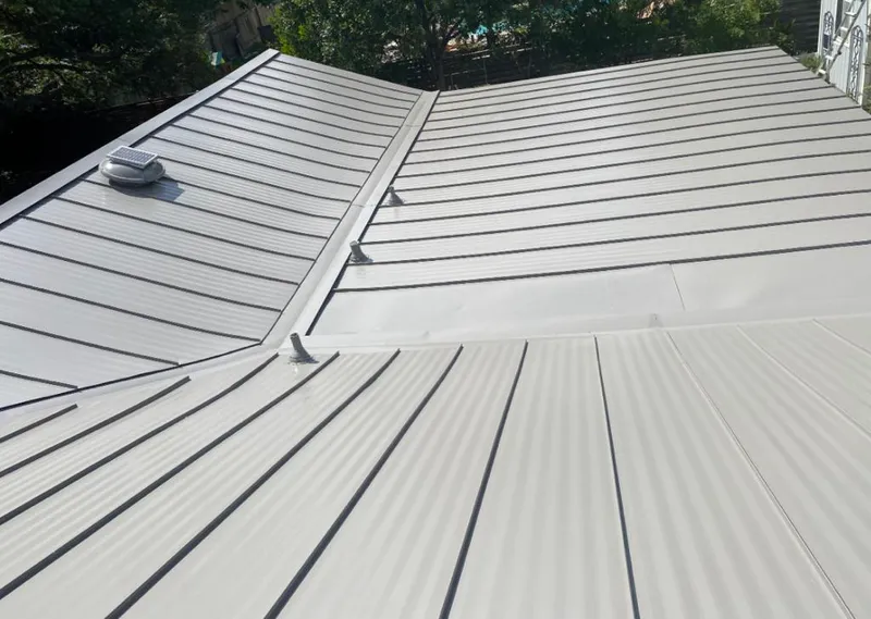 Solar attic fan installed on a metal roof for Roof Ventilation in Chesapeake Beach